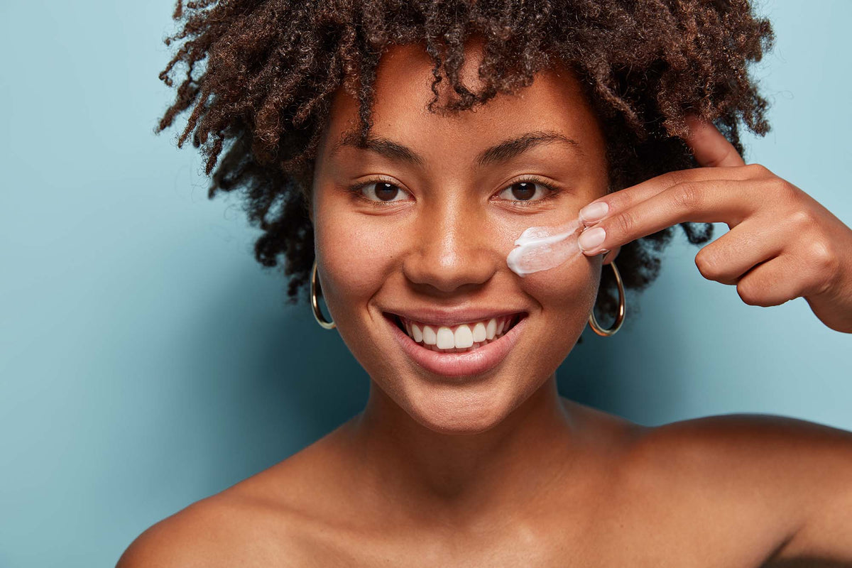 A natural lady applying i-Cann CBD Face cream